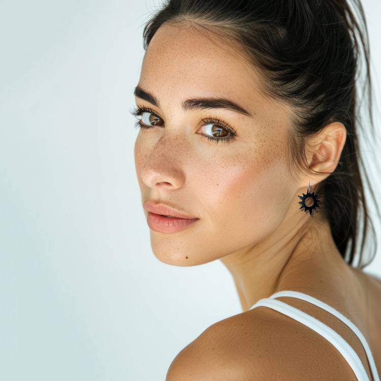 Woman wearing Sunburst Bicycle Tube Earrings | Sustainable Fashion Jewelry | Kaden & Kai