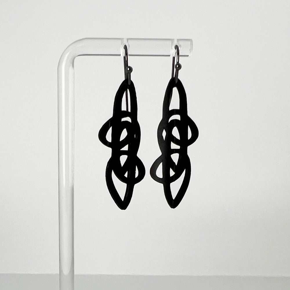 Pure Whimsy Bicycle Tube Earrings on Display Stand | Sustainable Jewelry | Kaden & Kai