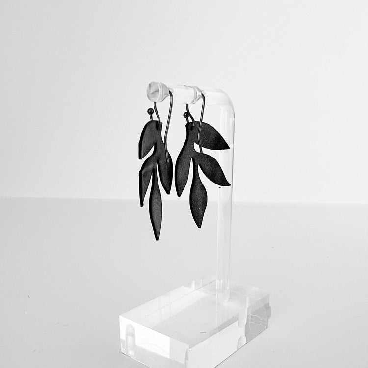 Back of Wisteria Leaf Bicycle Tube Earrings on stand | Sustainable Fashion Earrings | Kaden & Kai