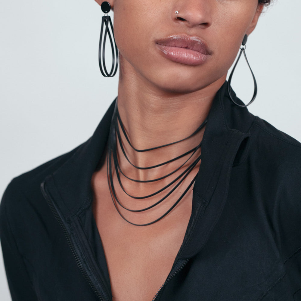 Runway Model Wearing Shockwave Necklace and Earrings from Galaxy Collection
