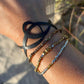 Pure Whimsy Bicycle Tube Bracelet on Wrist with beaded bracelets | Sustainable Fashion Designed by Kaden & Kai