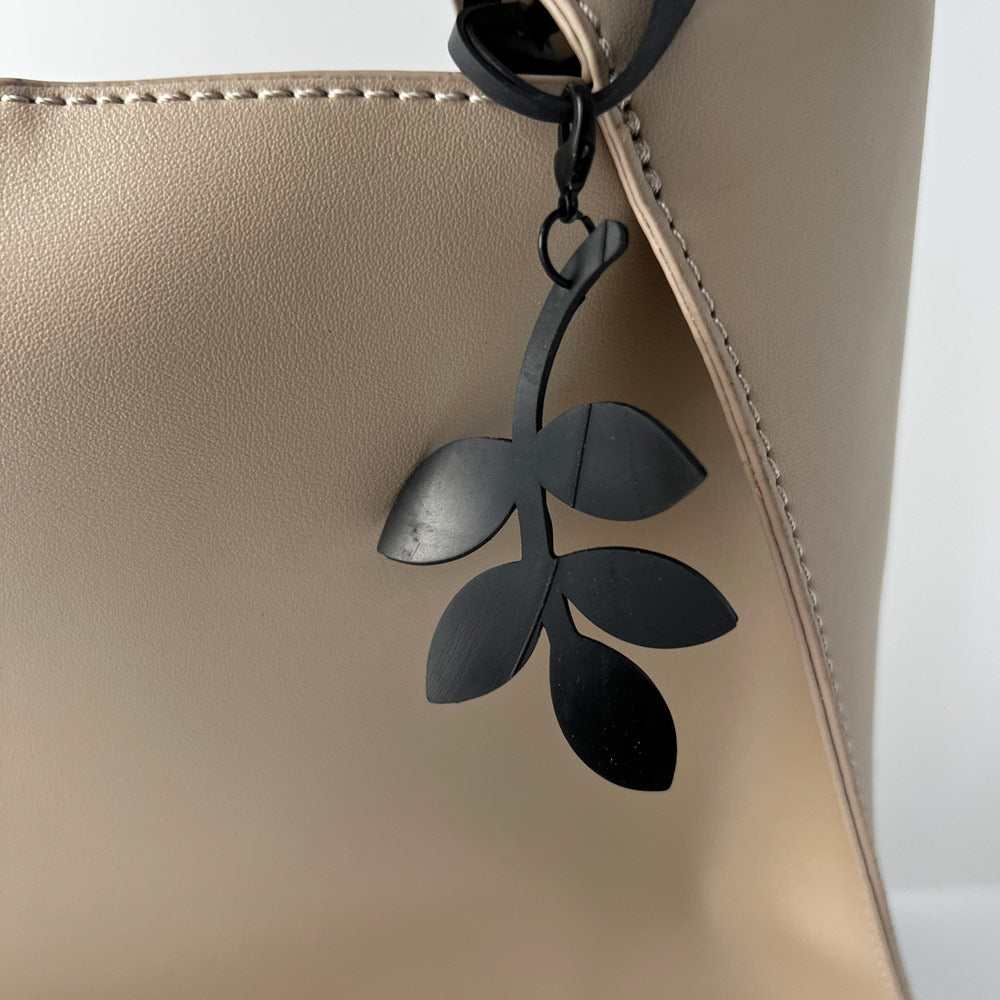 Twirly Twig Bag Charm keychains handcrafted from upcycled bicycle tubes.