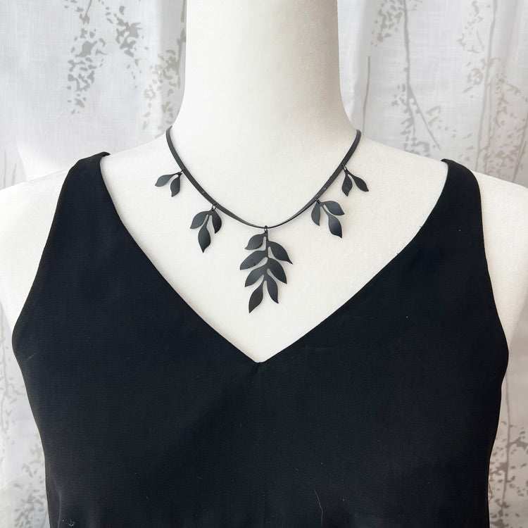 Cascading Vine Charm Necklace on Mannequin | Sustainable Fashion Jewelry | Vine Collection | Kaden & Kai