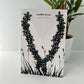 Sustainable Fashion Jewelry | Daisy Necklace Upcycled from Bicycle Tube on Display Card | Kaden & Kai